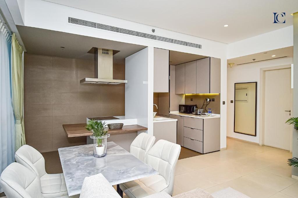 Small apartment layout with a kitchen and living room, part of West Avenue Tower.