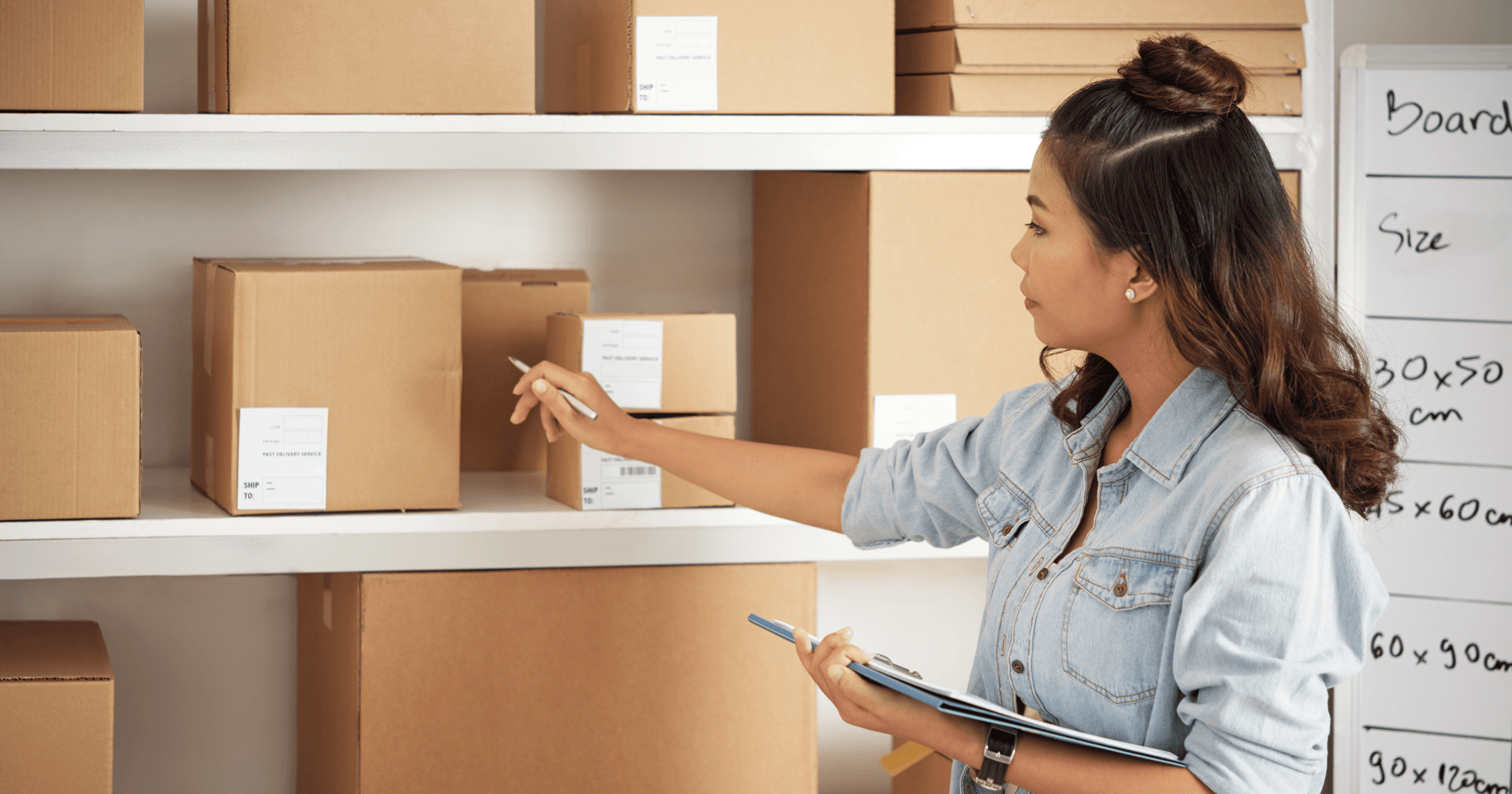 Business owner checking packed products