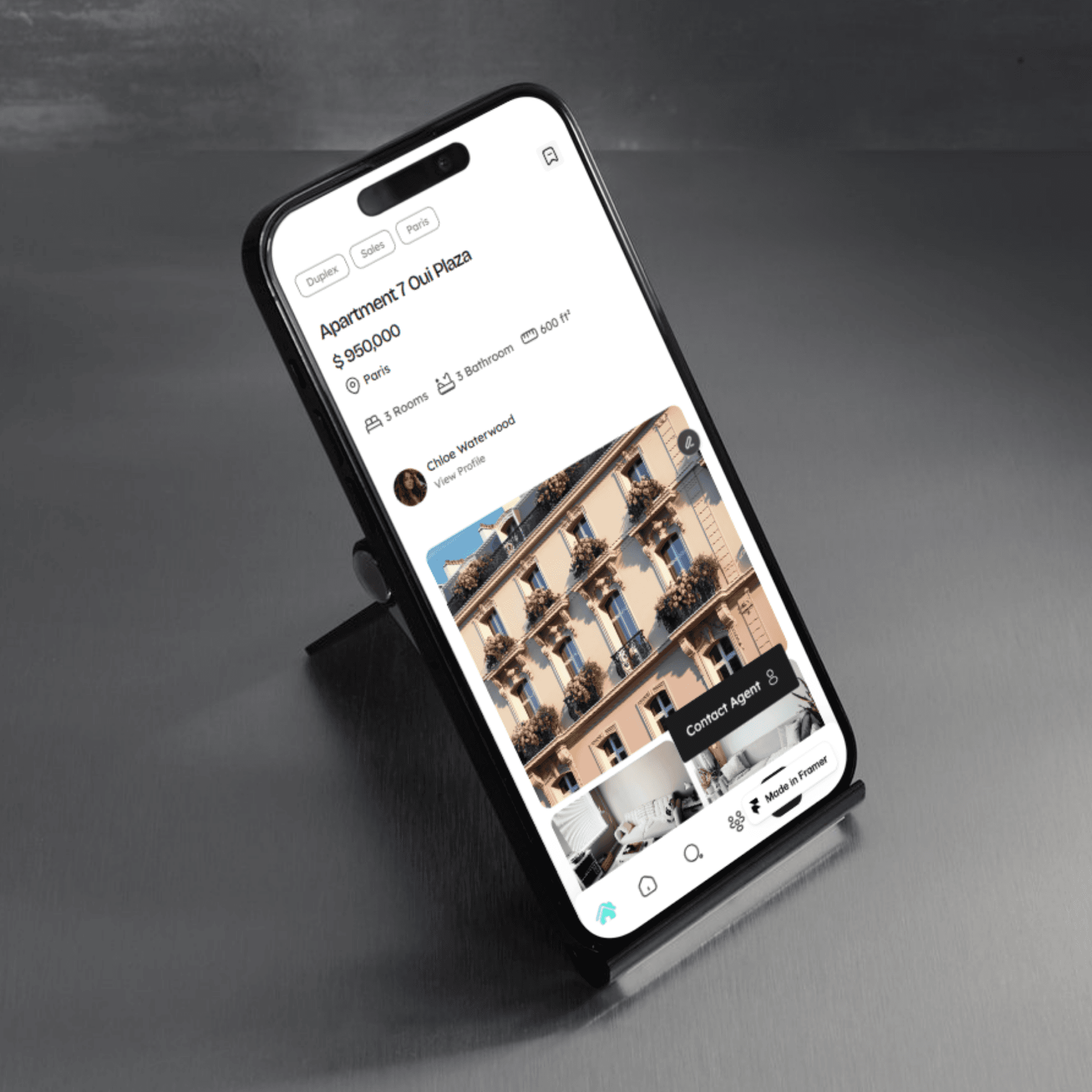 a white car parked in front of a building