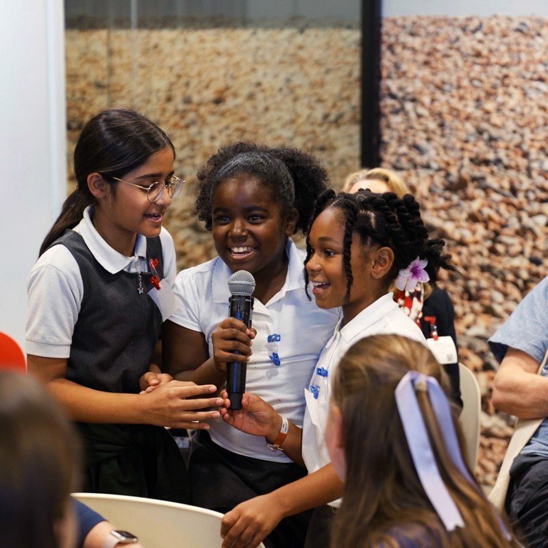 Image of children singing and smiling