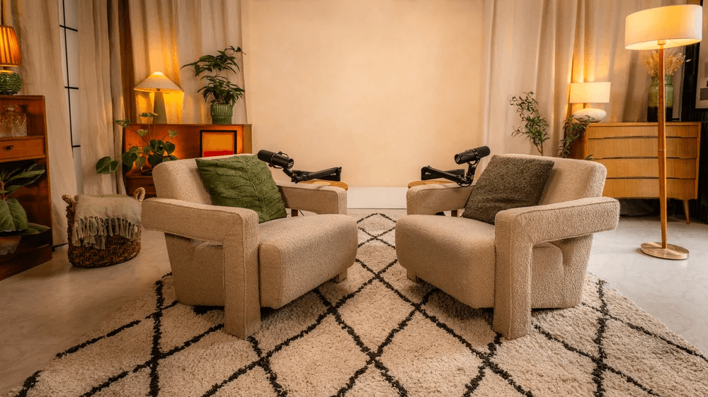 Terracotta wall interior with wooden architectural elements and dramatic natural light.