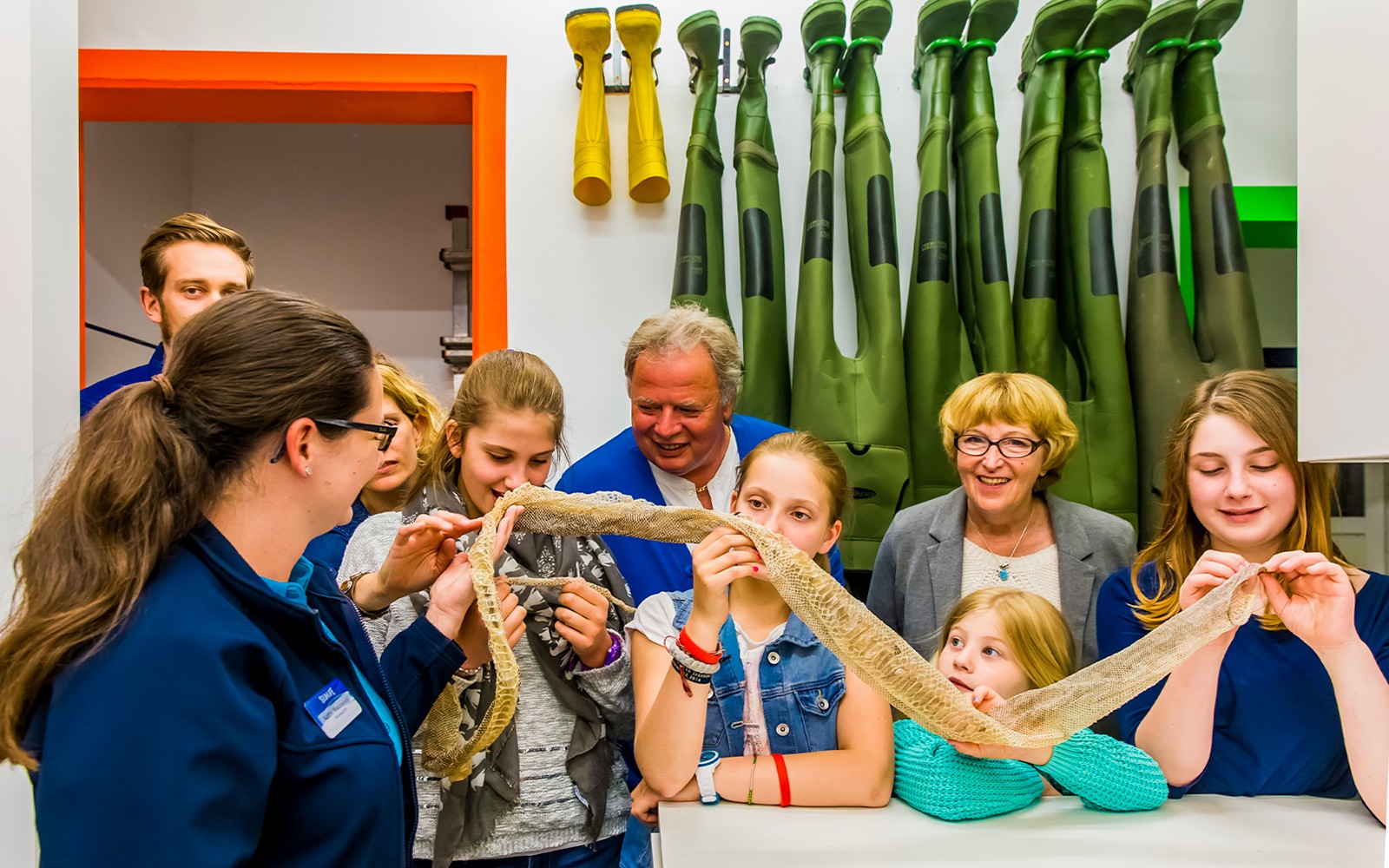 Kids exploring snake skin on SEA LIFE London Behind the Scenes Tour.
