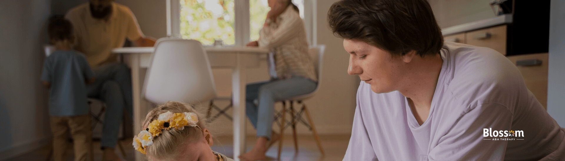 A girl and an RBT playing on the floor during ABA therapy