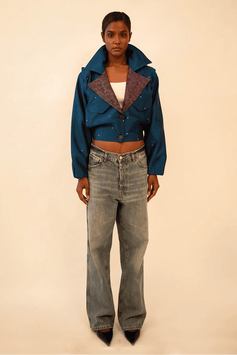 AMBR is our one-of-a-kind cropped two-toned silk brocade&nbsp; bomber jacket, handcrafted by skilled artisans in-house using a vintage silk saris