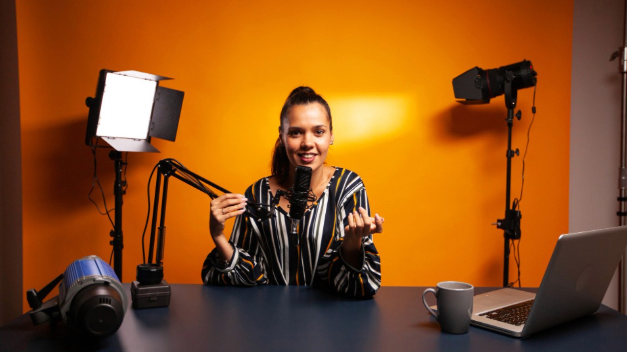 Vlogger recording video using professional microphone