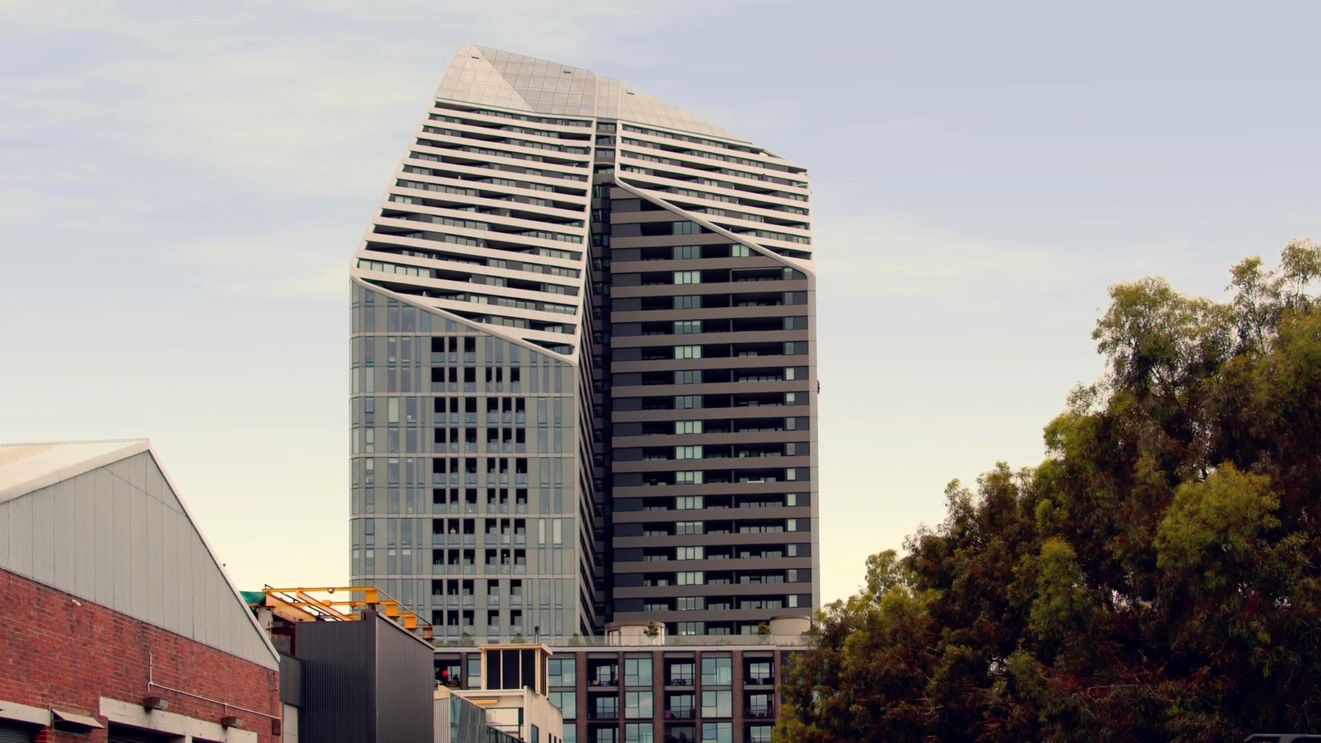 An exterior shot of a modern high-rise building or skyscraper