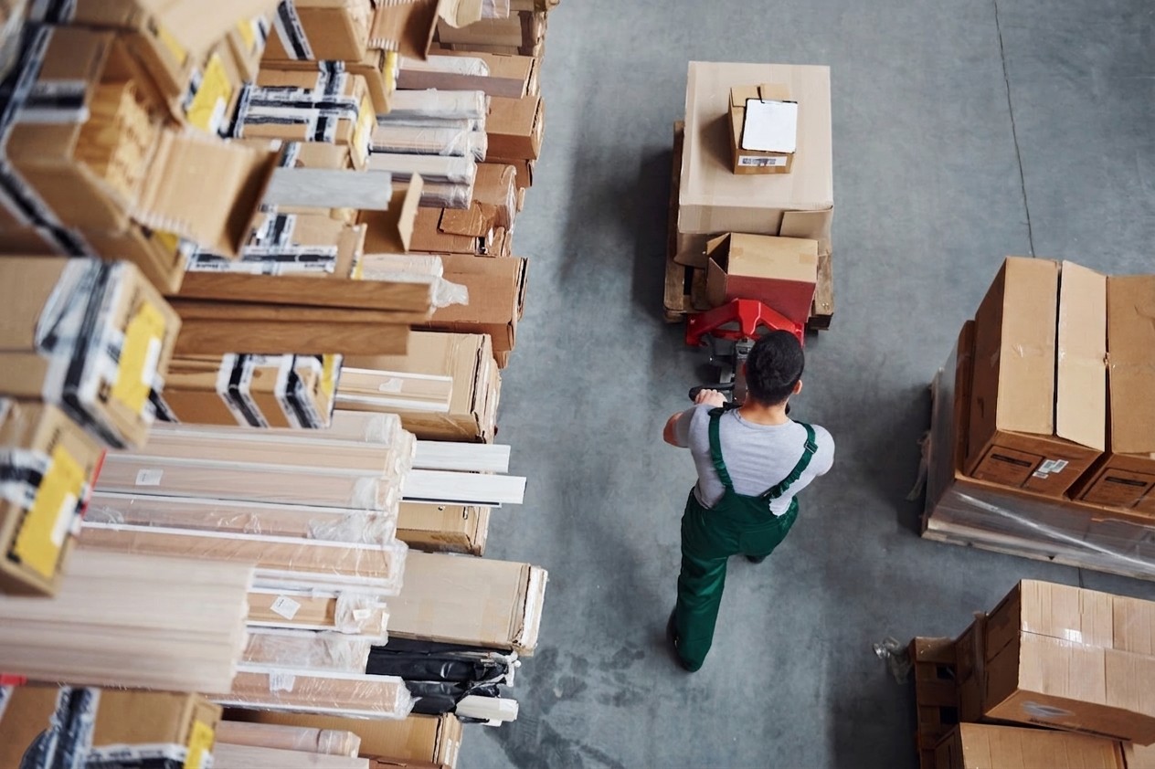 man comissioning packages in a warehouse