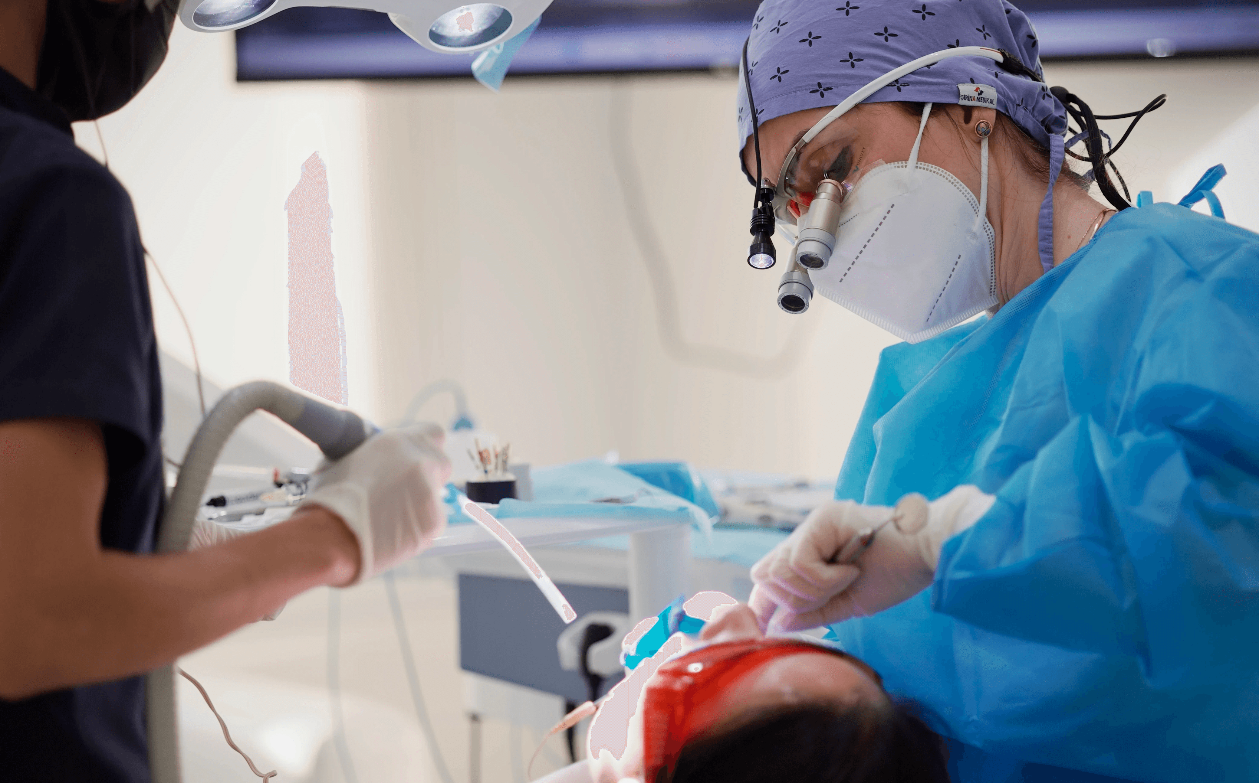 A patient having her wisdom teeth extracted by an expert dentist by Invisalign Center