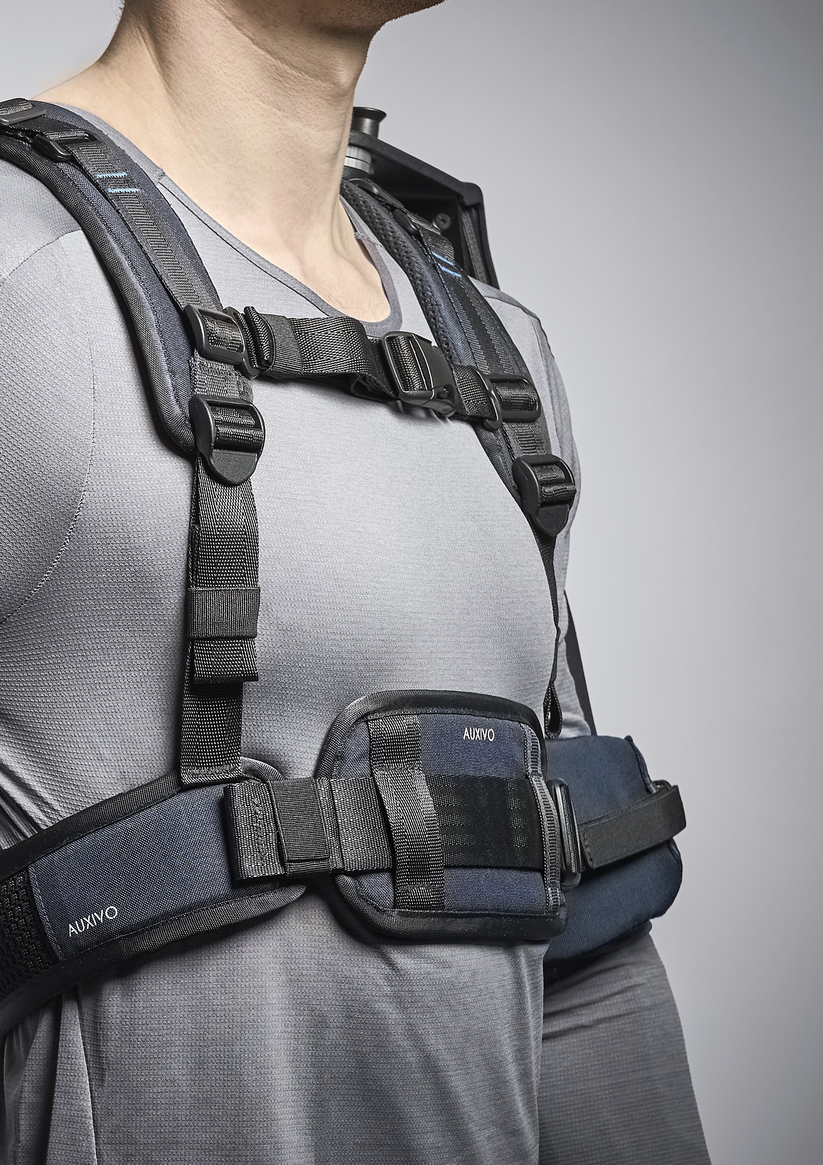 Details of the straps, buckles, and belt of the Auxivo DeltaSuit exoskeleton, designed for secure attachment and optimal weight distribution on the torso.
