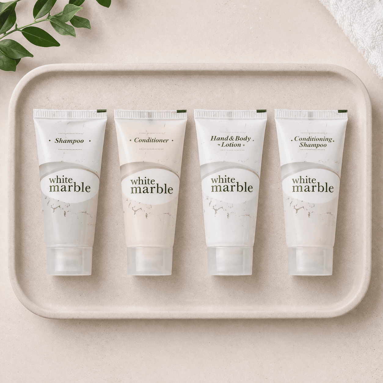 White Marble hotel amenities set including shampoo, conditioner, conditioning shampoo and body lotion arranged evenly on a cream concrete tray in top view, by Transmacro Amenities