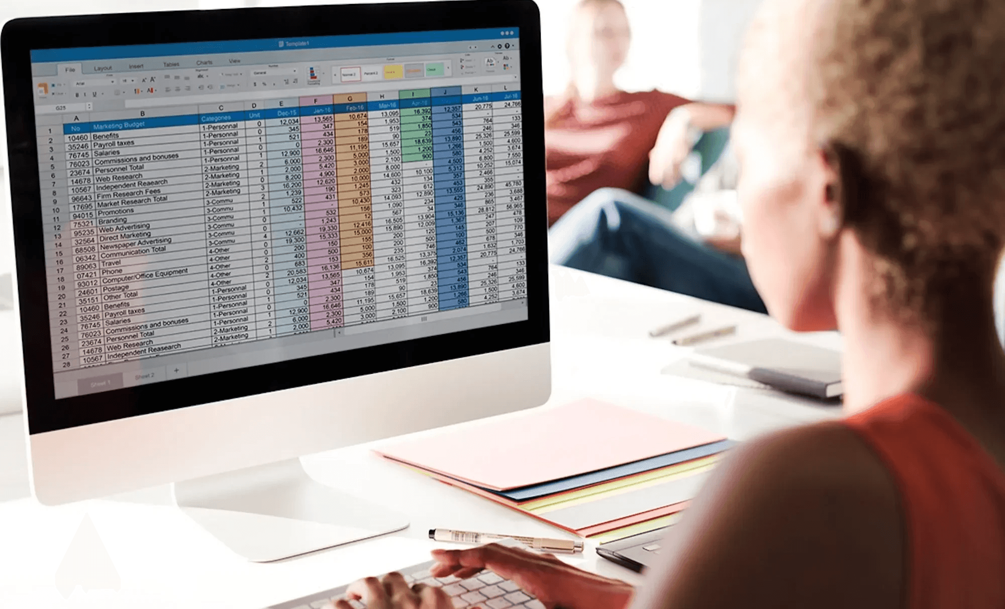 Person working on desktop spreadsheet computer - How to add VBA to Excel