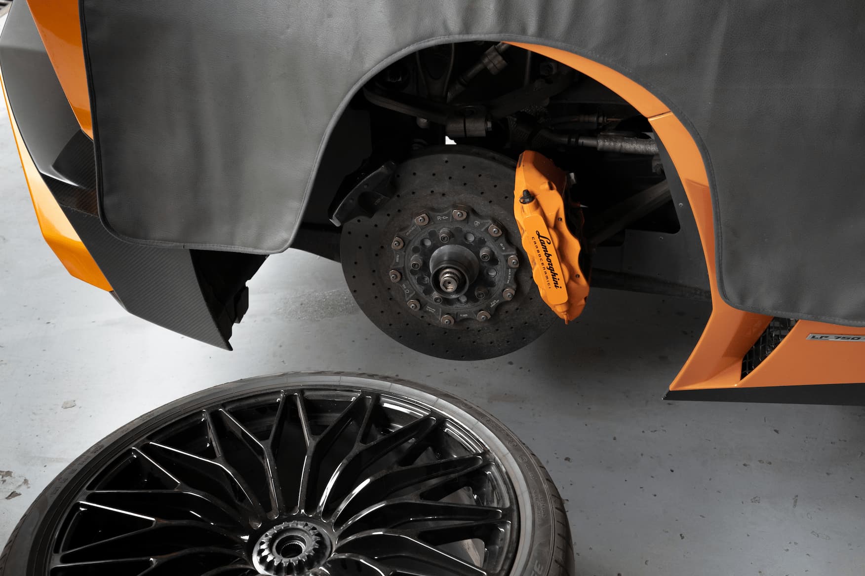 Car brake being repaired by mechanic at Ideal