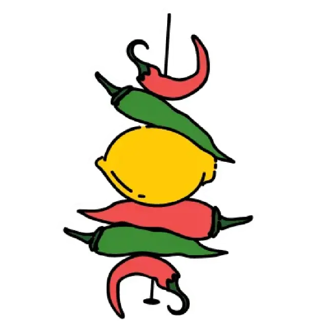 A traditional Indian charm of a lemon and several green and red chilies strung on a thread.