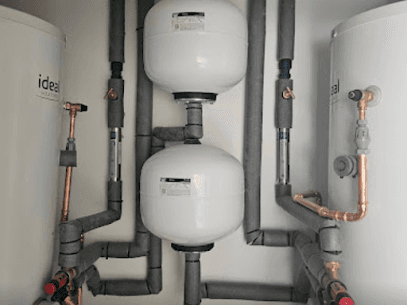 An emergency plumber fixing a leaky pipe in a bathroom