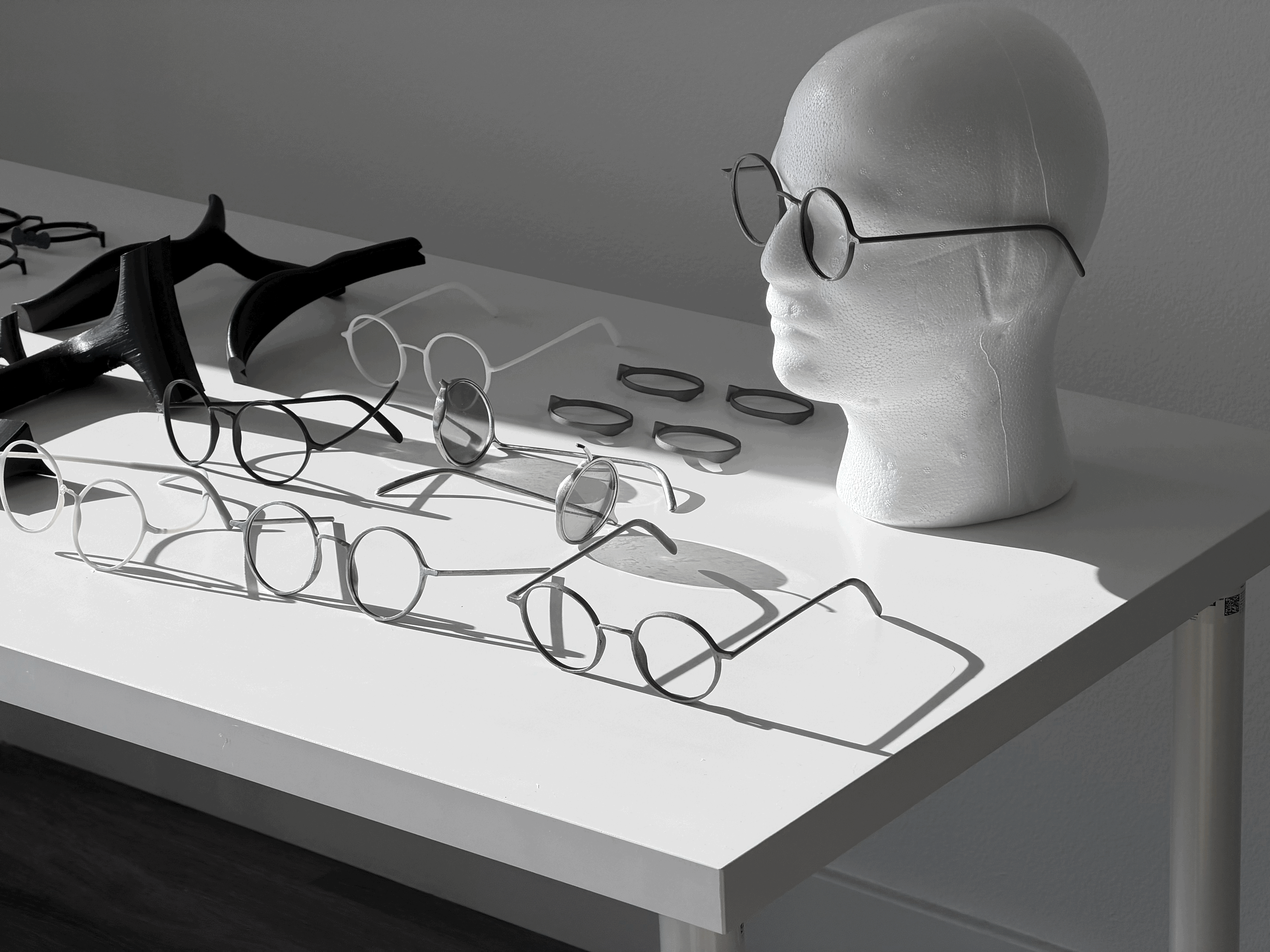 Streetside billboard with flyposters of the Batch.Works brand and illustrations