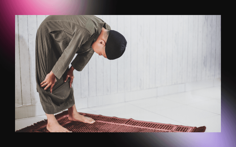 Performing Ruku (Bowing) in Salah: Hands raised to ears, body bent at waist, hands on knees