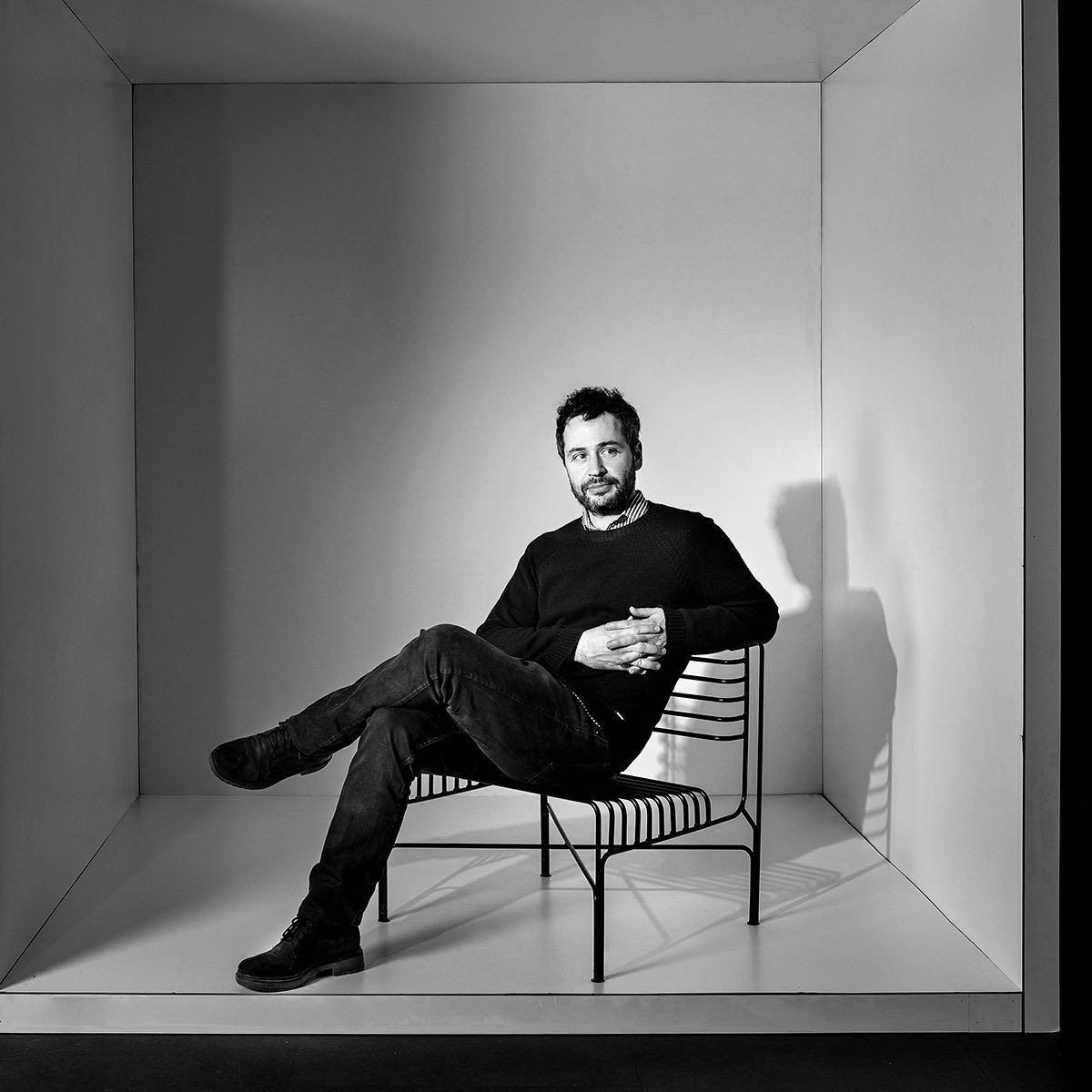 Rooftops of a coastal town with the sea in background
