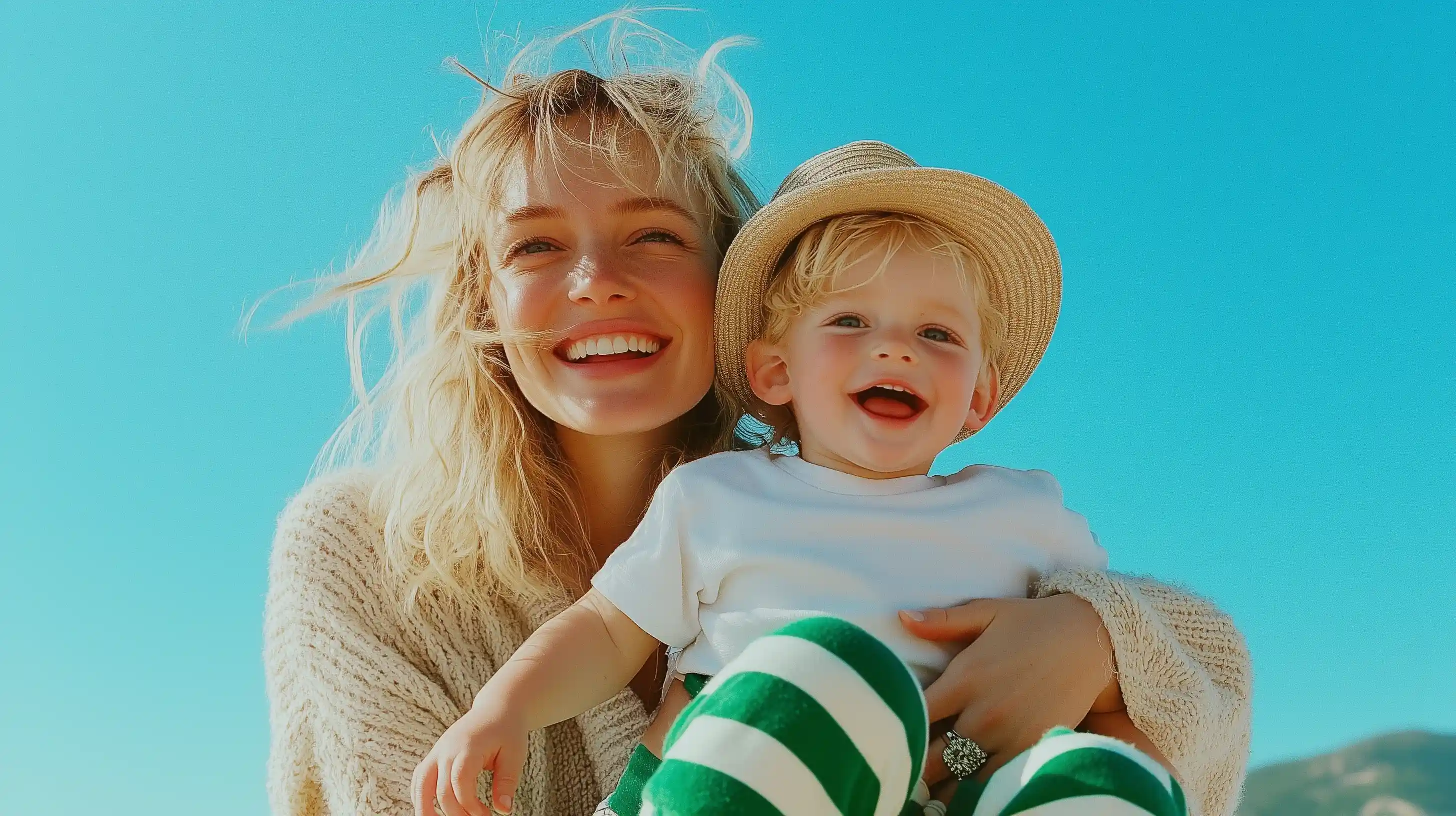 A smiling mother and her young child enjoying a sunny day, representing warmth, trust, and the essence of United Nannies’ premium care services.