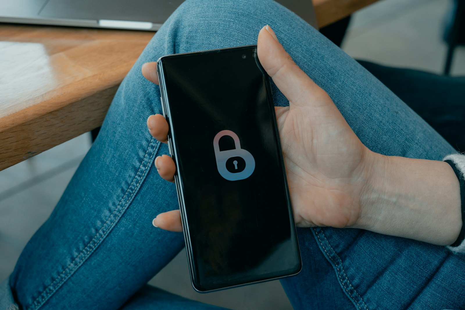 black and white smartphone in persons hand