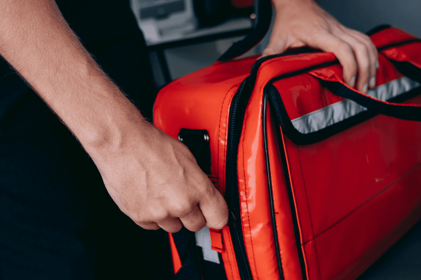 man preparing emergency bag at home