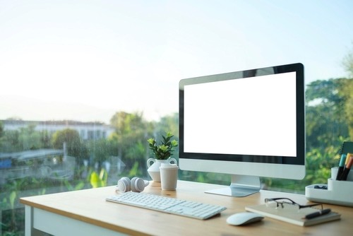 Comfortable workspace with blank screen