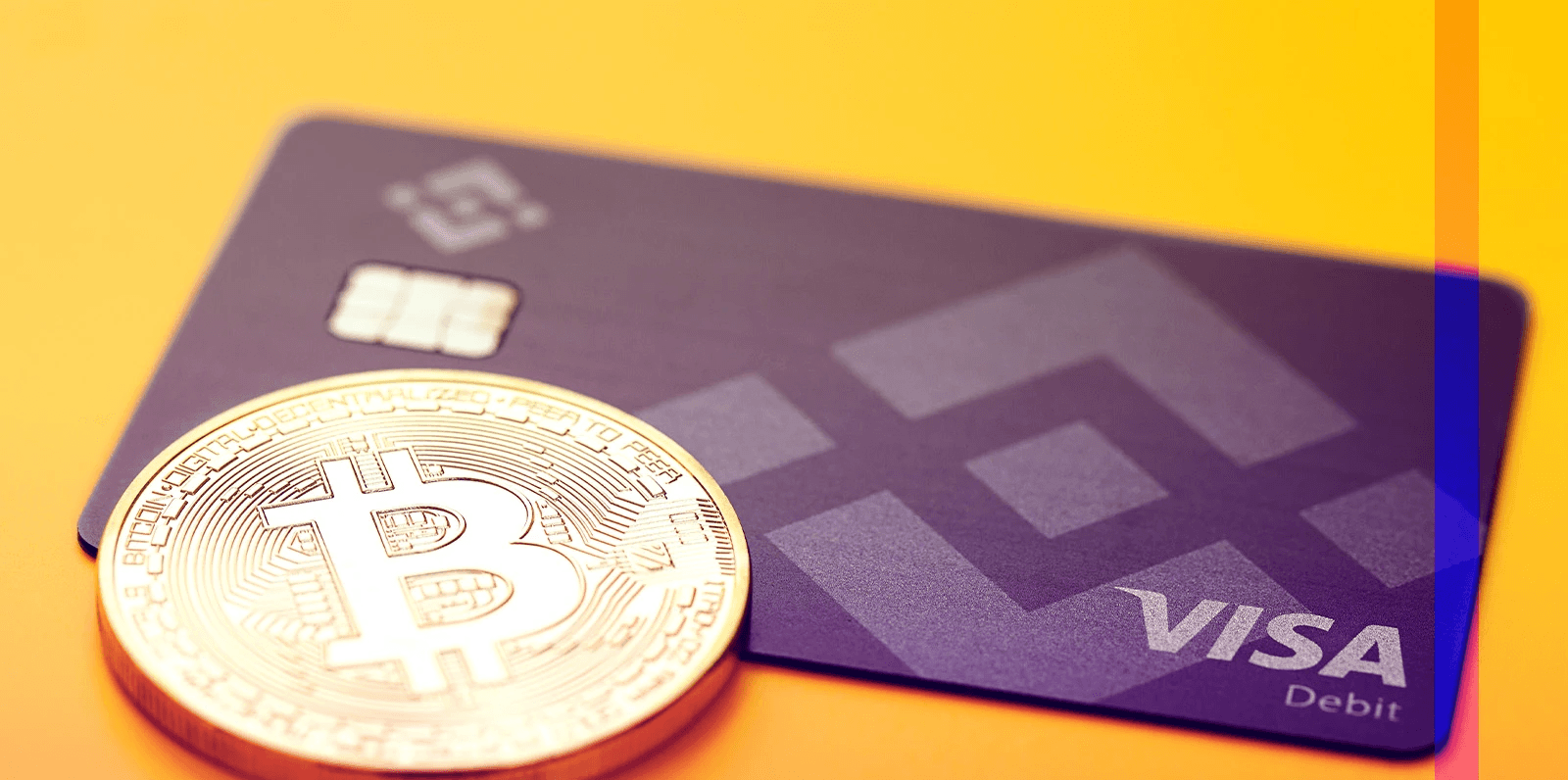 Bitcoin coin resting on visa card - Can I Buy Crypto With a Visa Gift Card