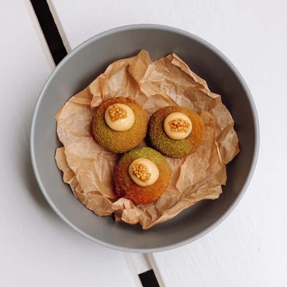 Croquetes of Alentejano pork neck with bay‑leaf mustard mayo – crispy, rich and perfect to share over a long Comporta lunch at Cavalariça.