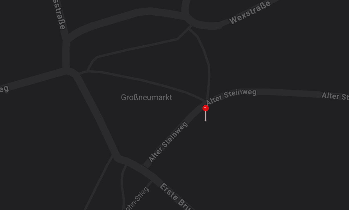 Map view displaying dark background with road outlines and a red dot indicating a specific location.