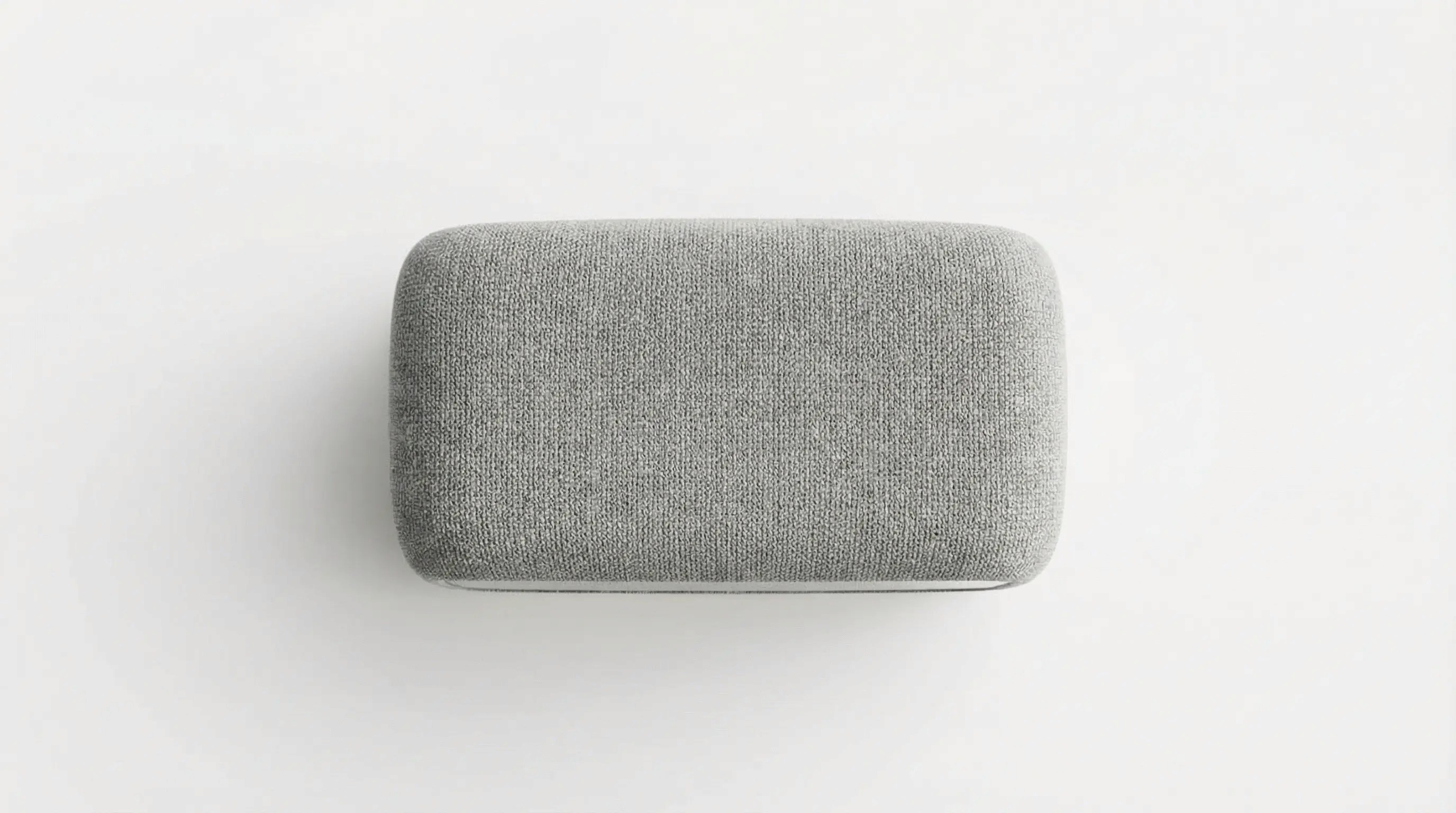 A rectangular gray eraser on a white background, showcasing a smooth and minimalist design.