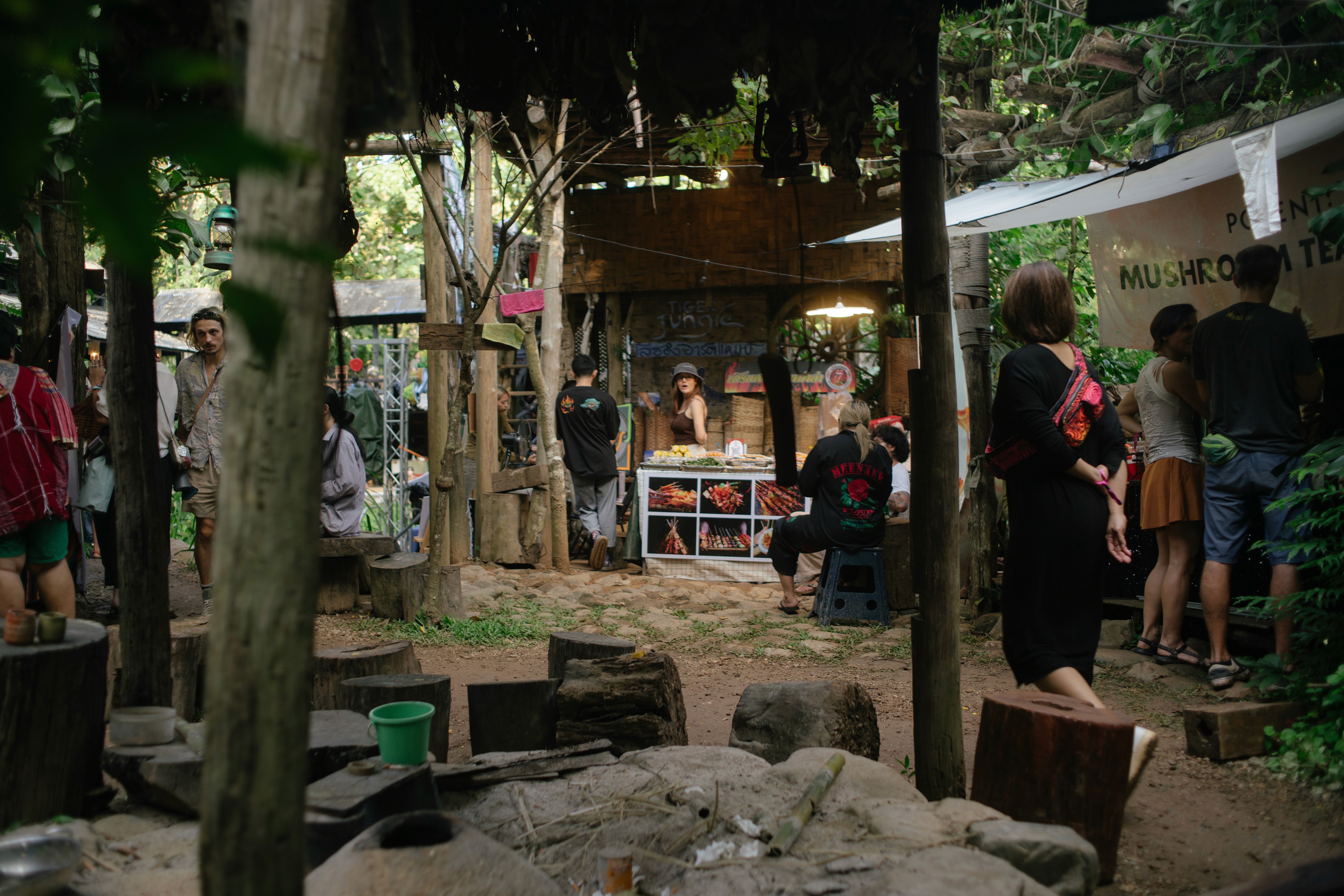 woman holding a phone and man looking at the phone. both are smiling