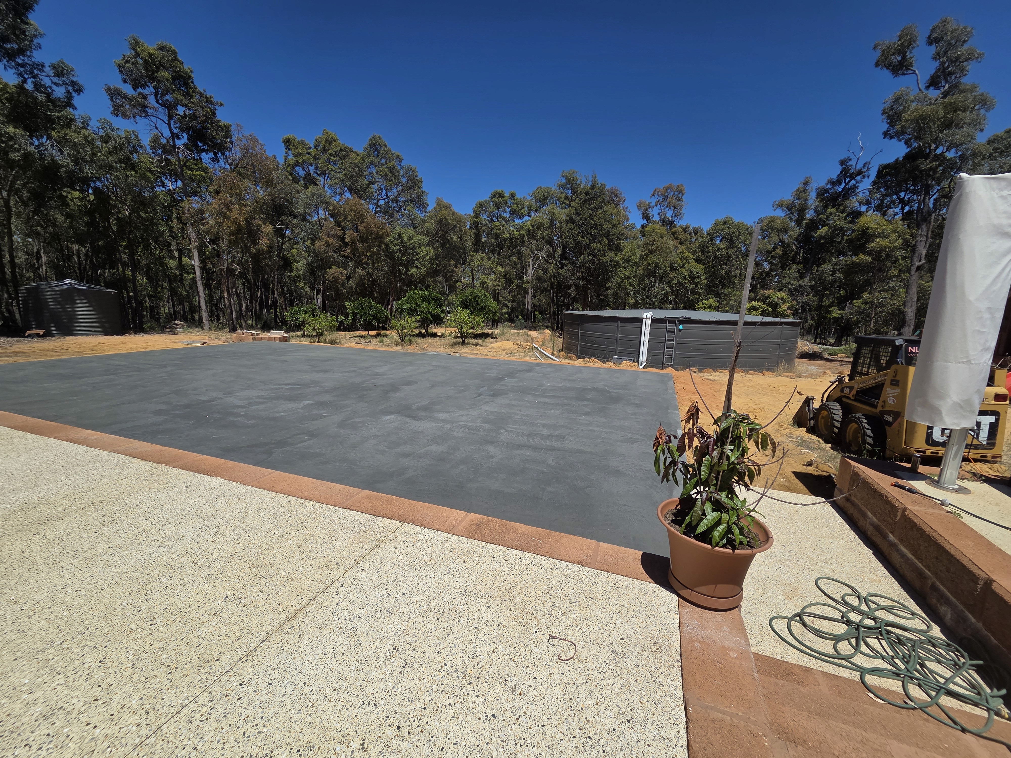 A smiling happy customer with curly hair on a blue background