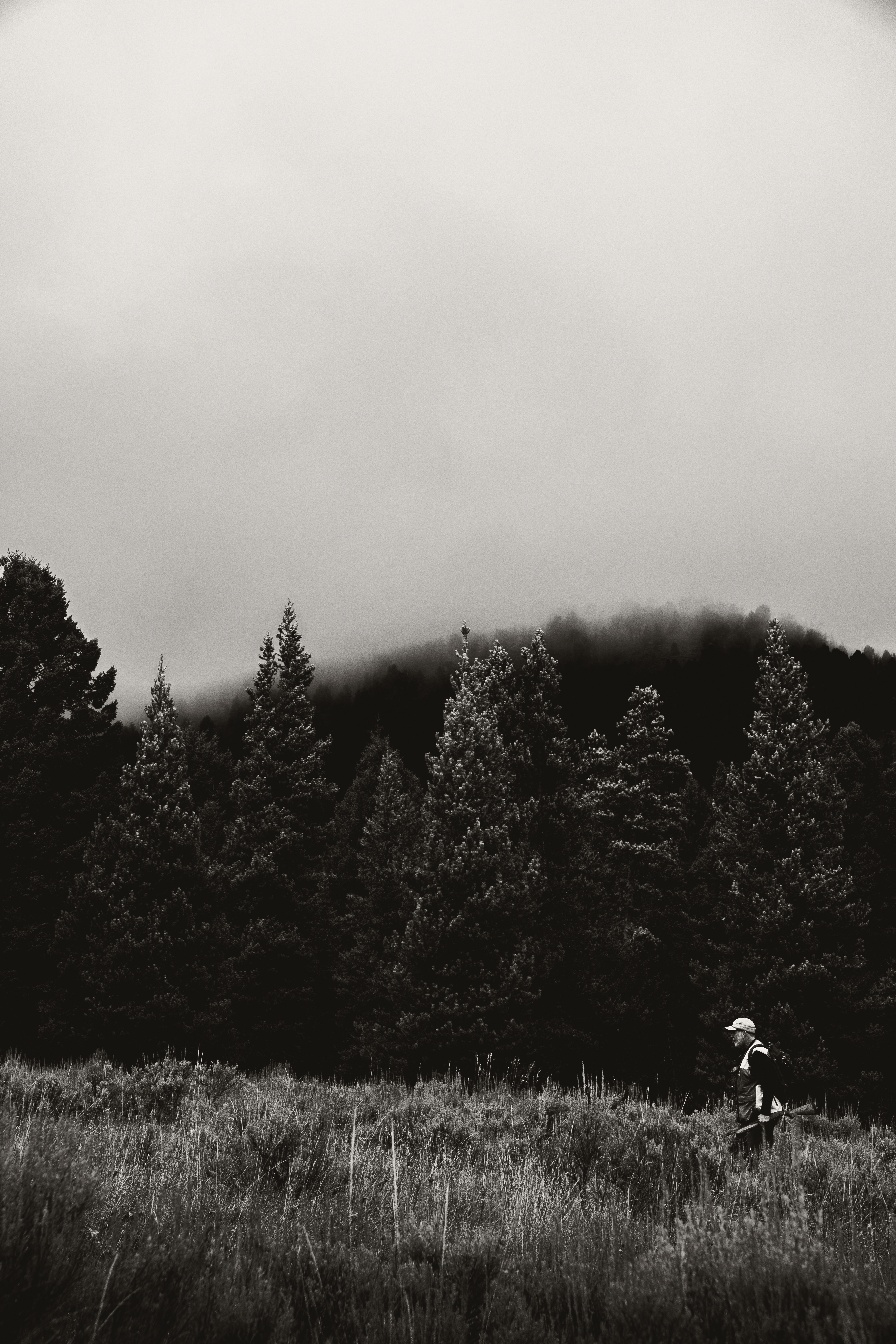 hunter hiking uphill Montana