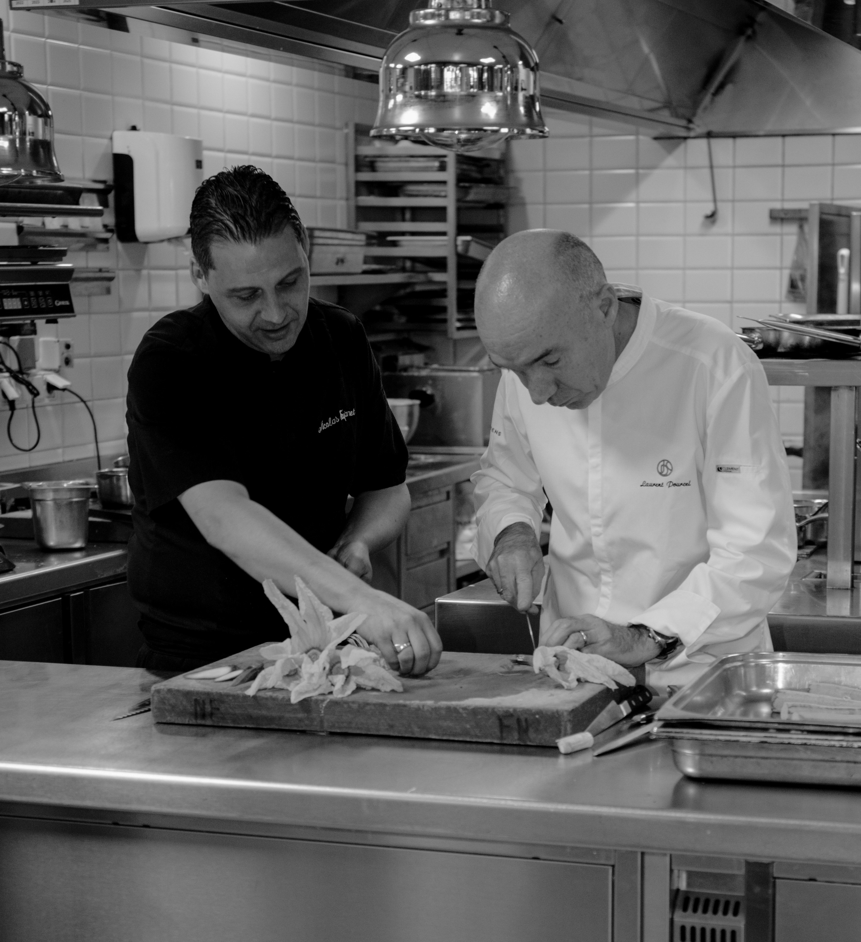 Metal Table standing aganst a wood wall