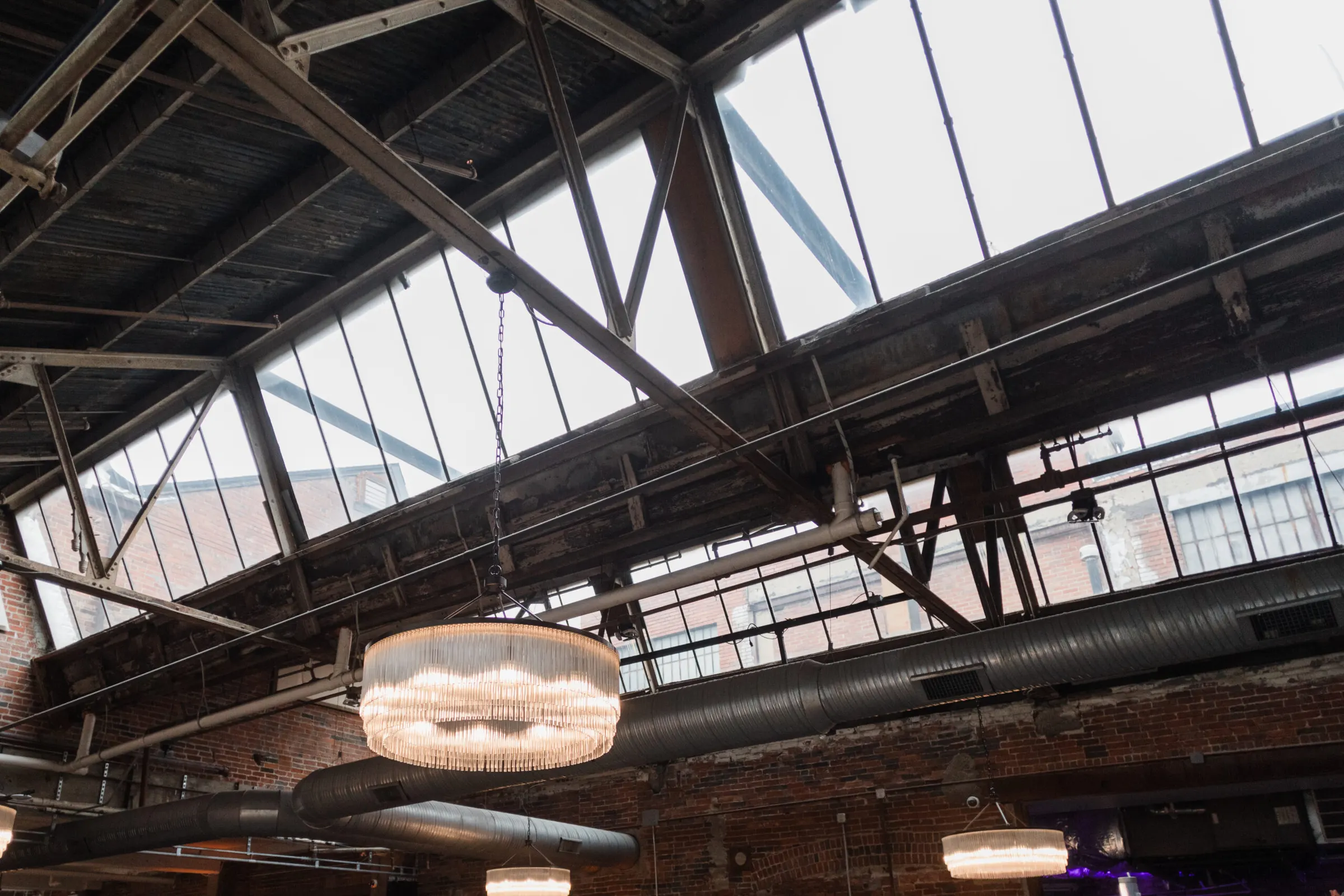 Sawtooth skylights, steel beams and chandeliers in The Gallery