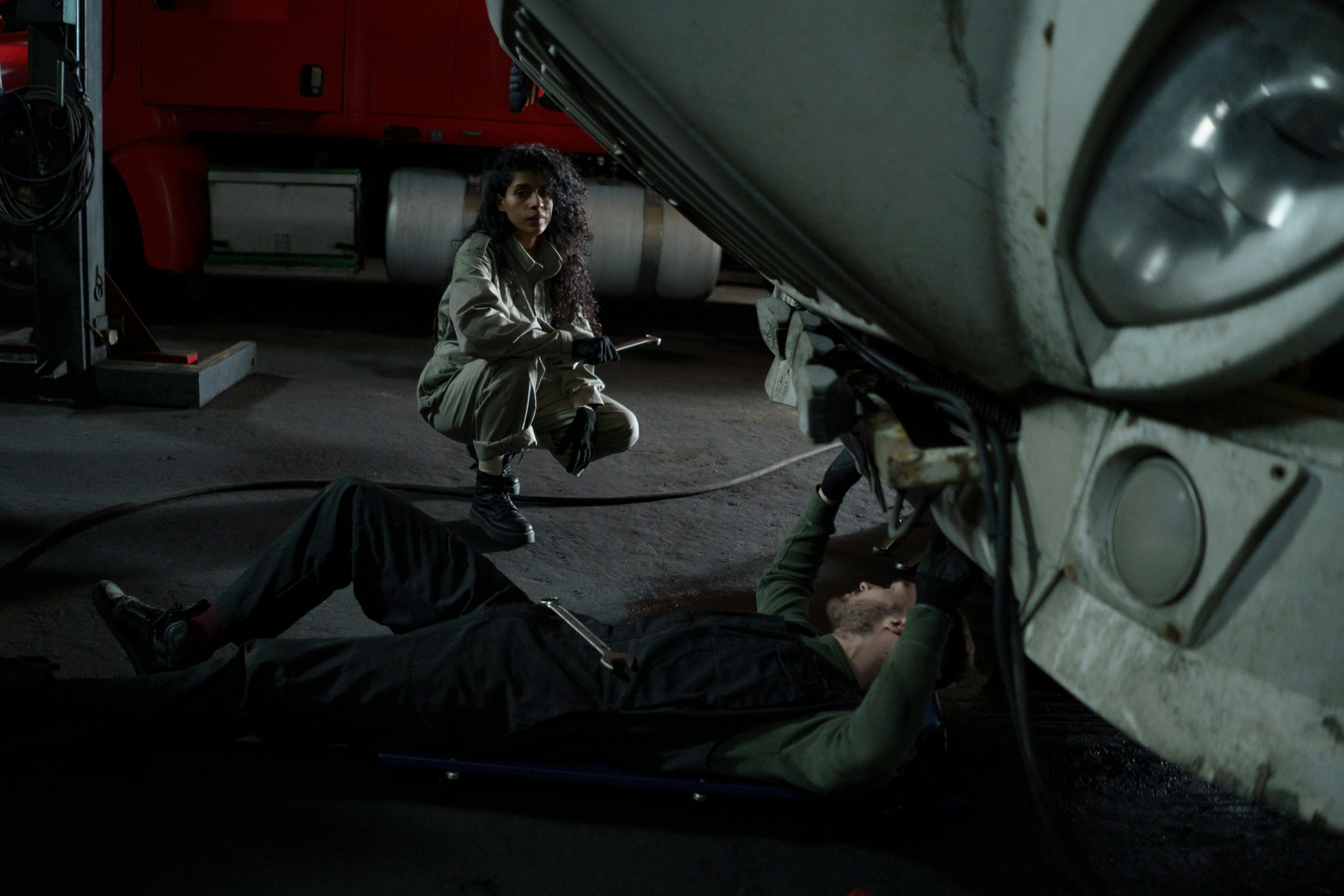 Mechanic looking under the hood