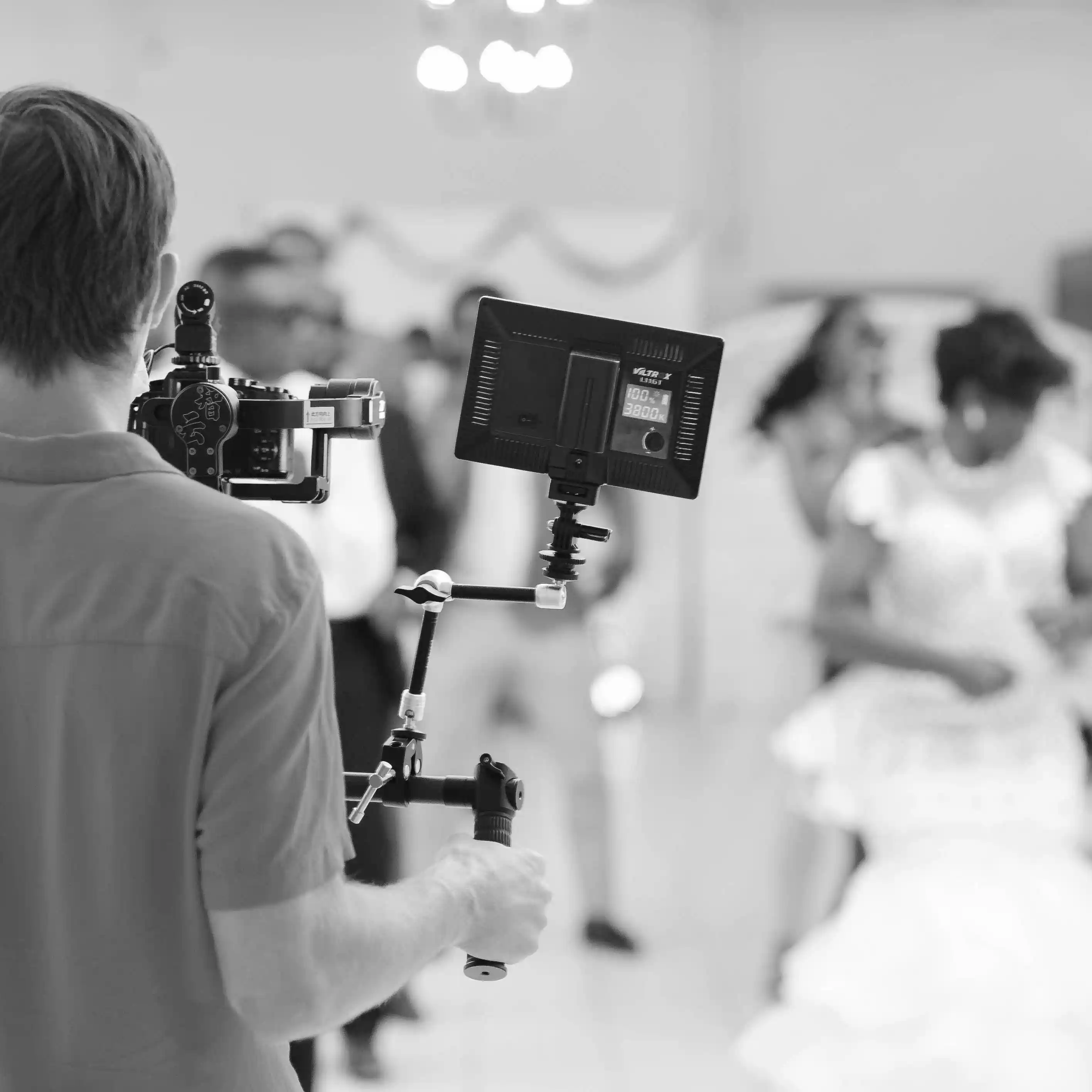 a blurry photo of a person standing in front of a wall