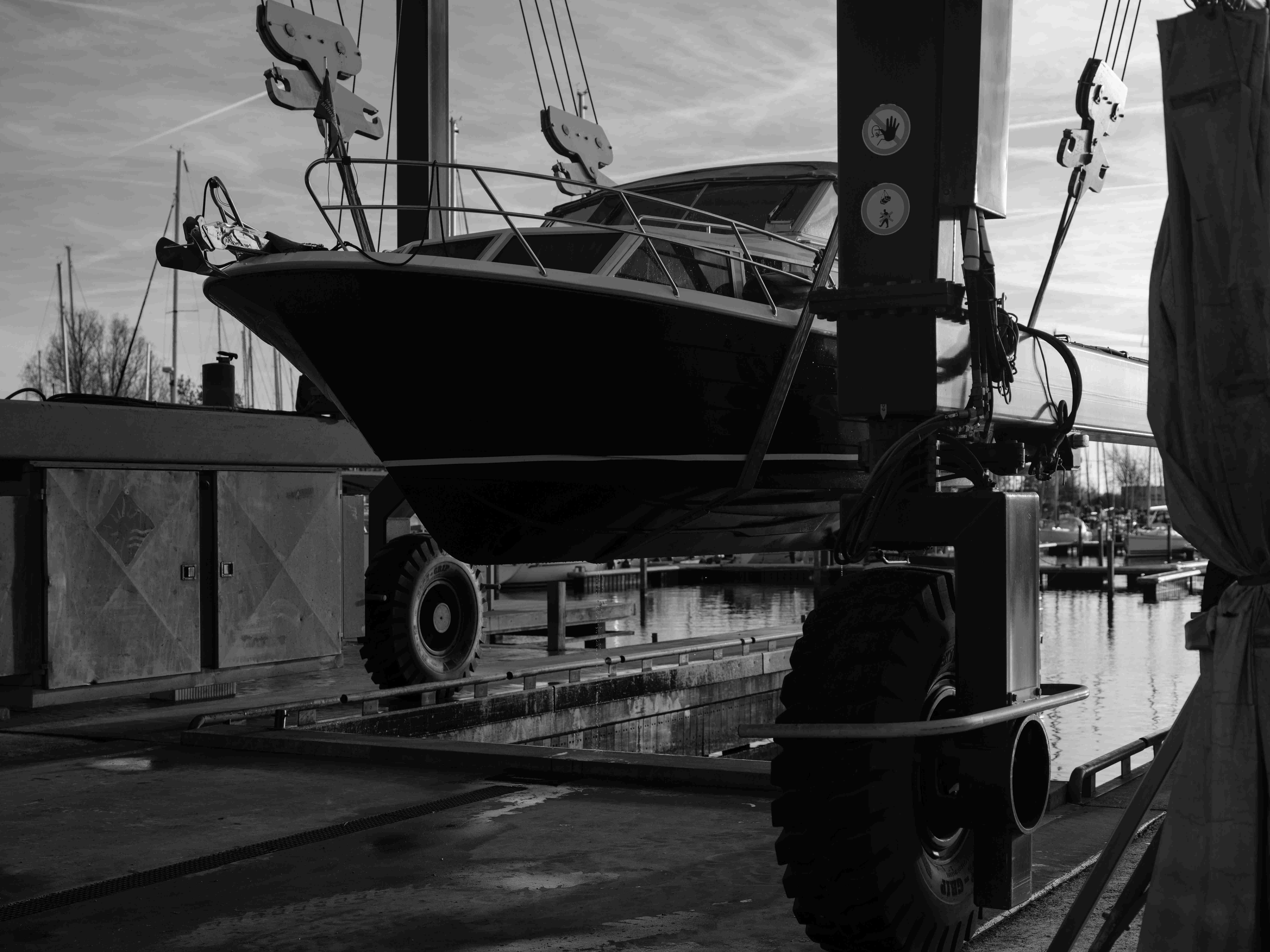 Motor yacht being hauled out at a Göcek marina as part of yacht registration and flag change compliance process