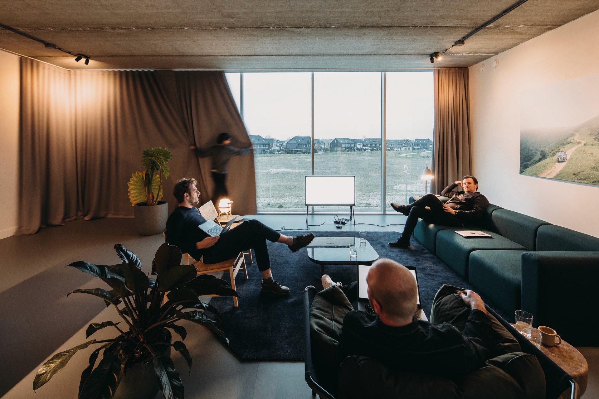Interior photo of Wellwood office space in the evening with the curtains almost closed