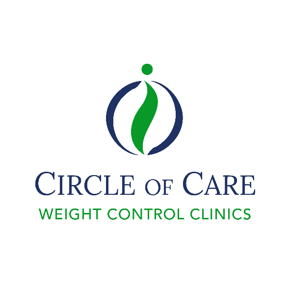 cars parked in front of green and white concrete building during daytime