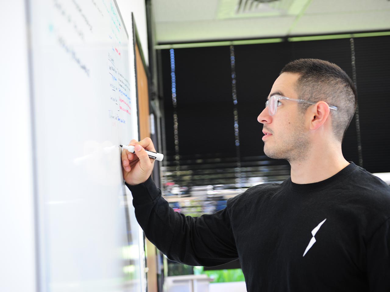 Brandon brainstorming at the Electriq Power office