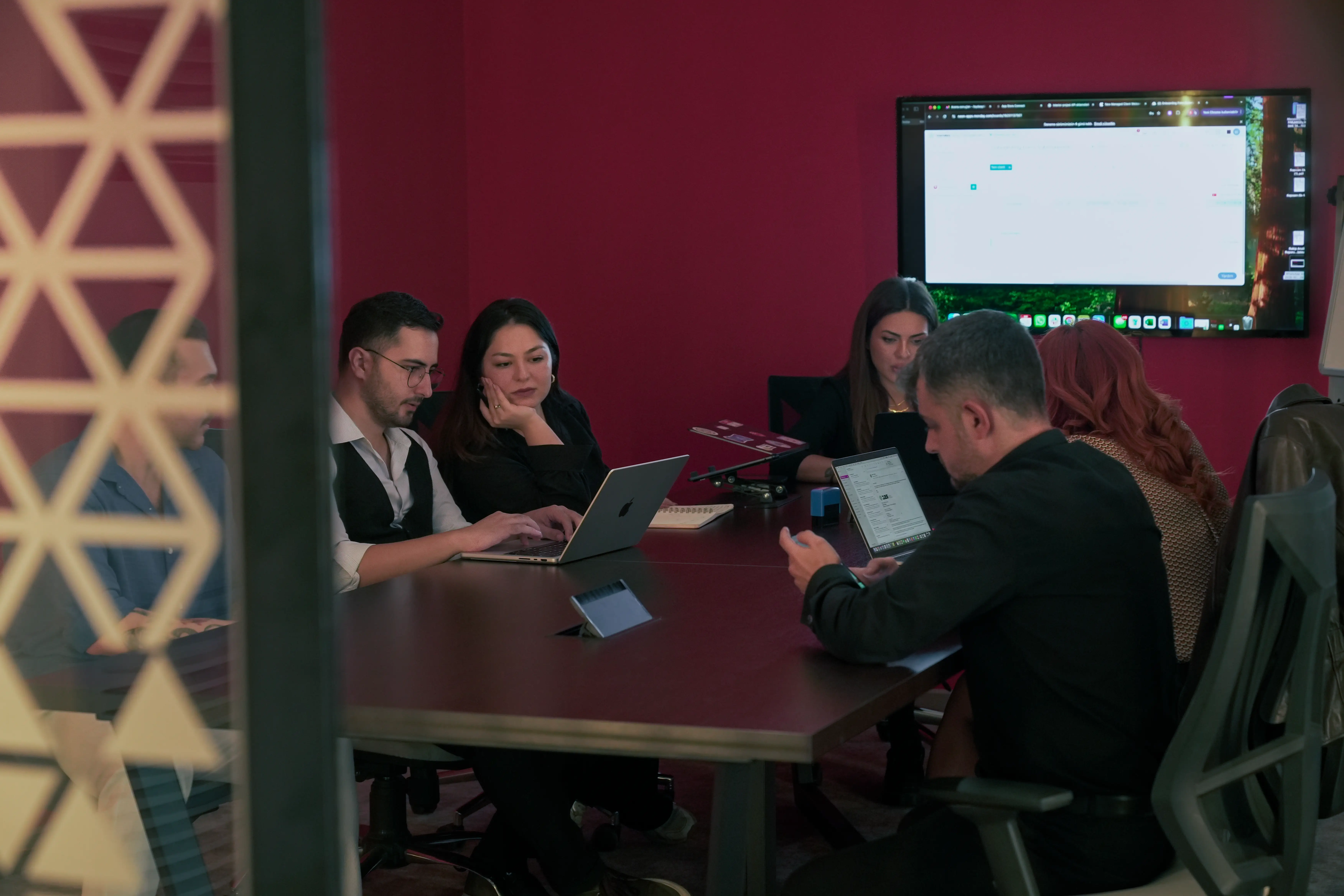 Designers and developers collaborating on new app features at Neon Apps.