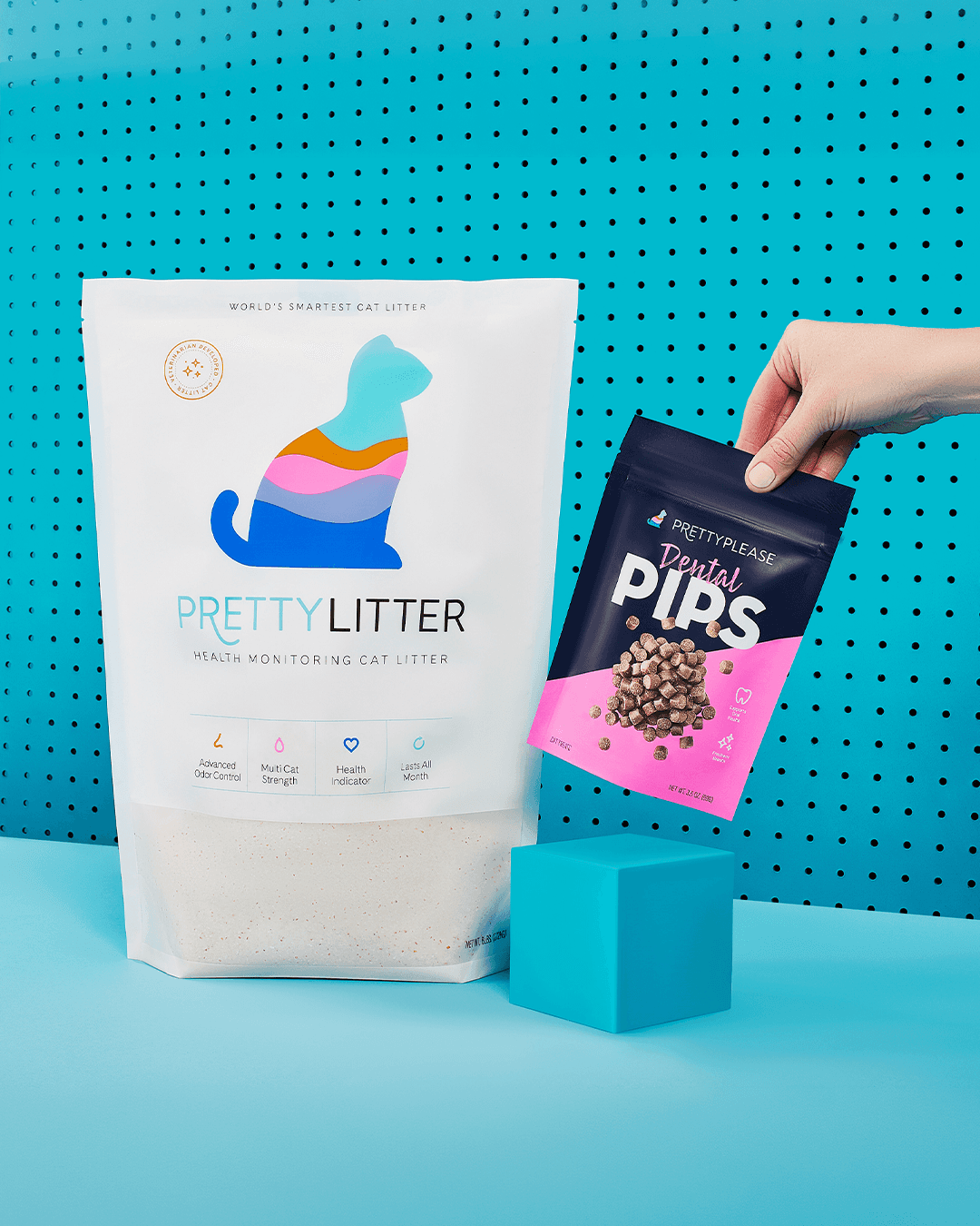 PrettyLitter brand design showing the minimal, purposeful design language applied to product packaging and DTC touchpoints including cat treats and cat litter