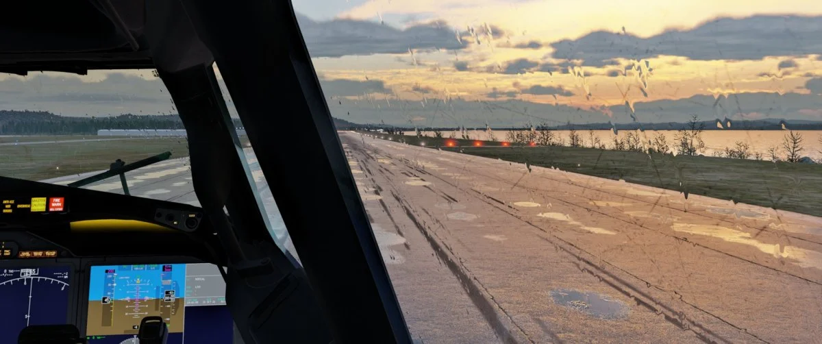 View from the AFL 737 MAX cockpit through a rain-covered window onto a wet runway at dusk