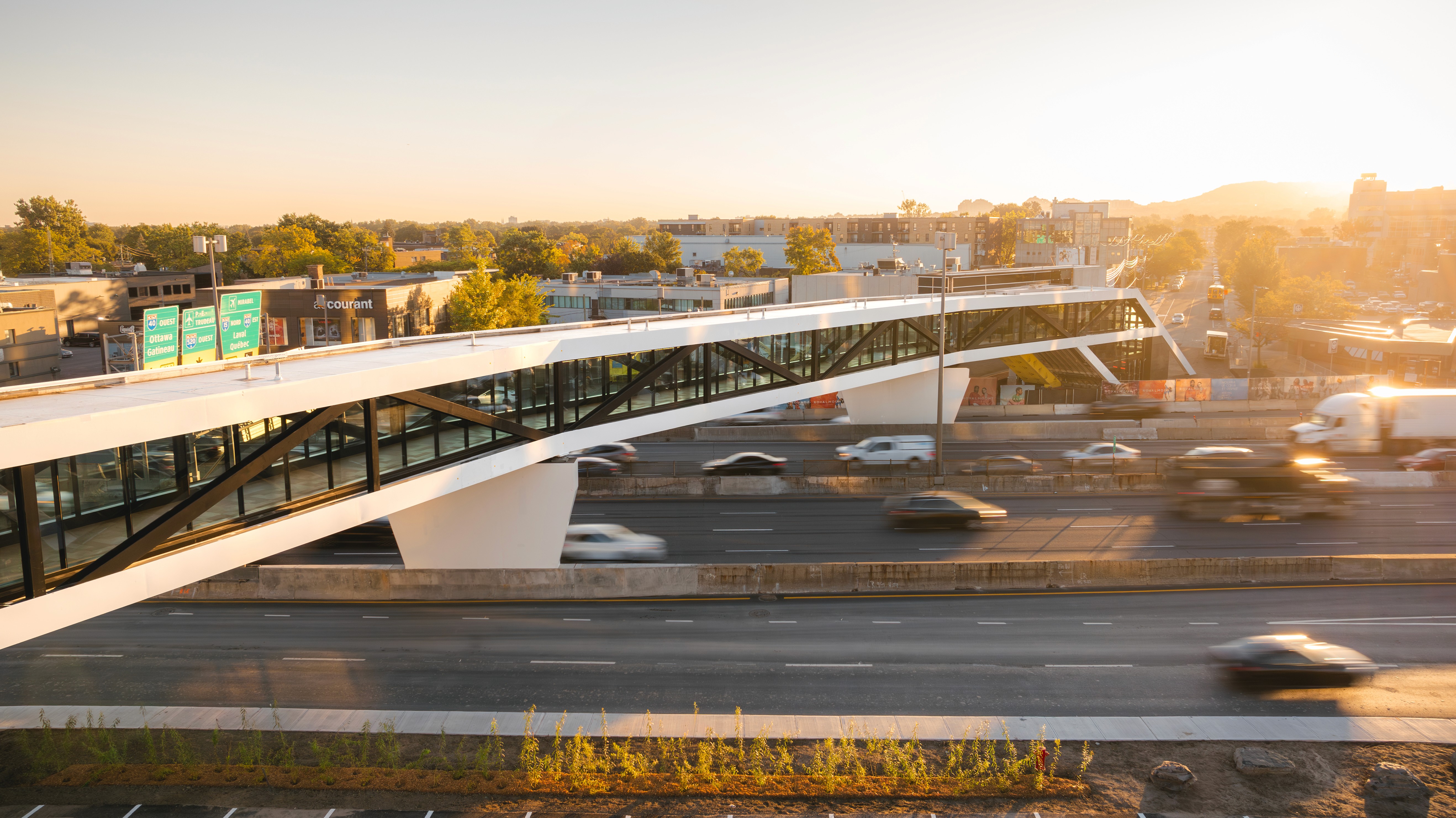 aerial view of a pedestrian tunnel of a shopping center above a highway