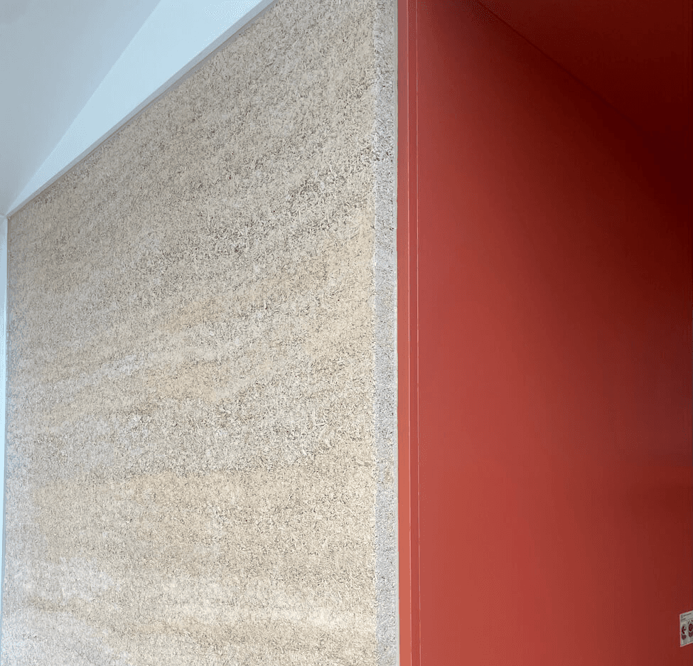 A photo shows how hempcrete blocks made the wall look clean and durable