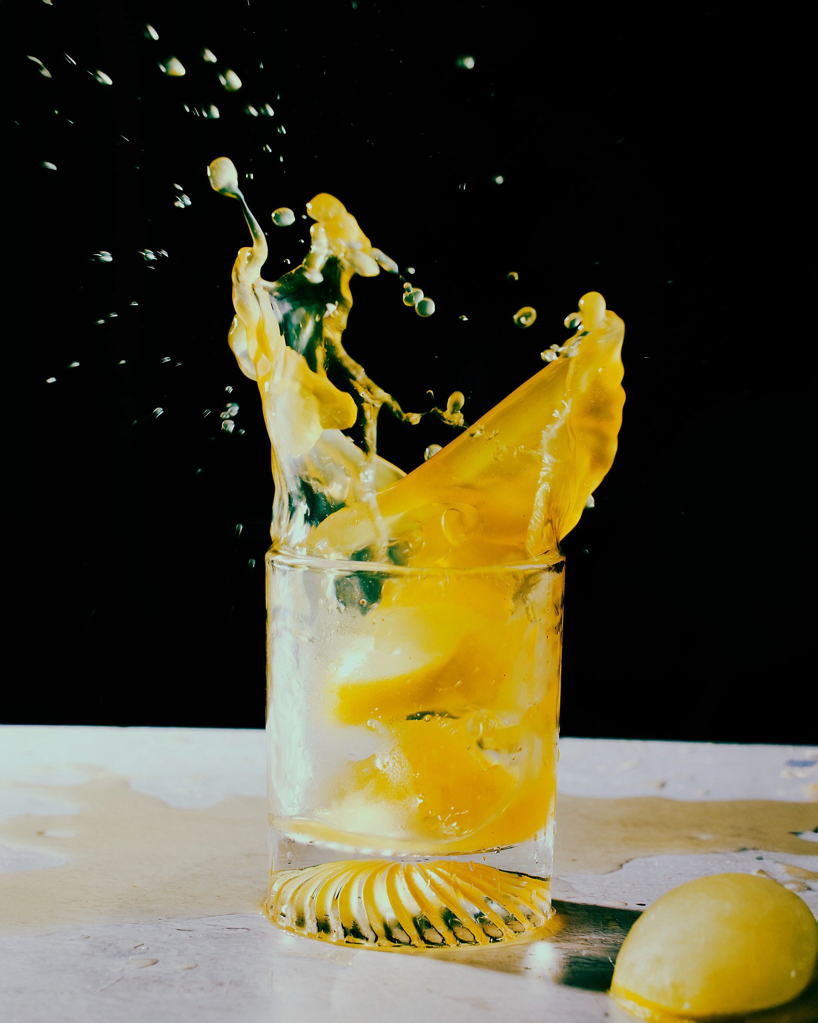 A tall waterfall cascades into a turquoise pool below.