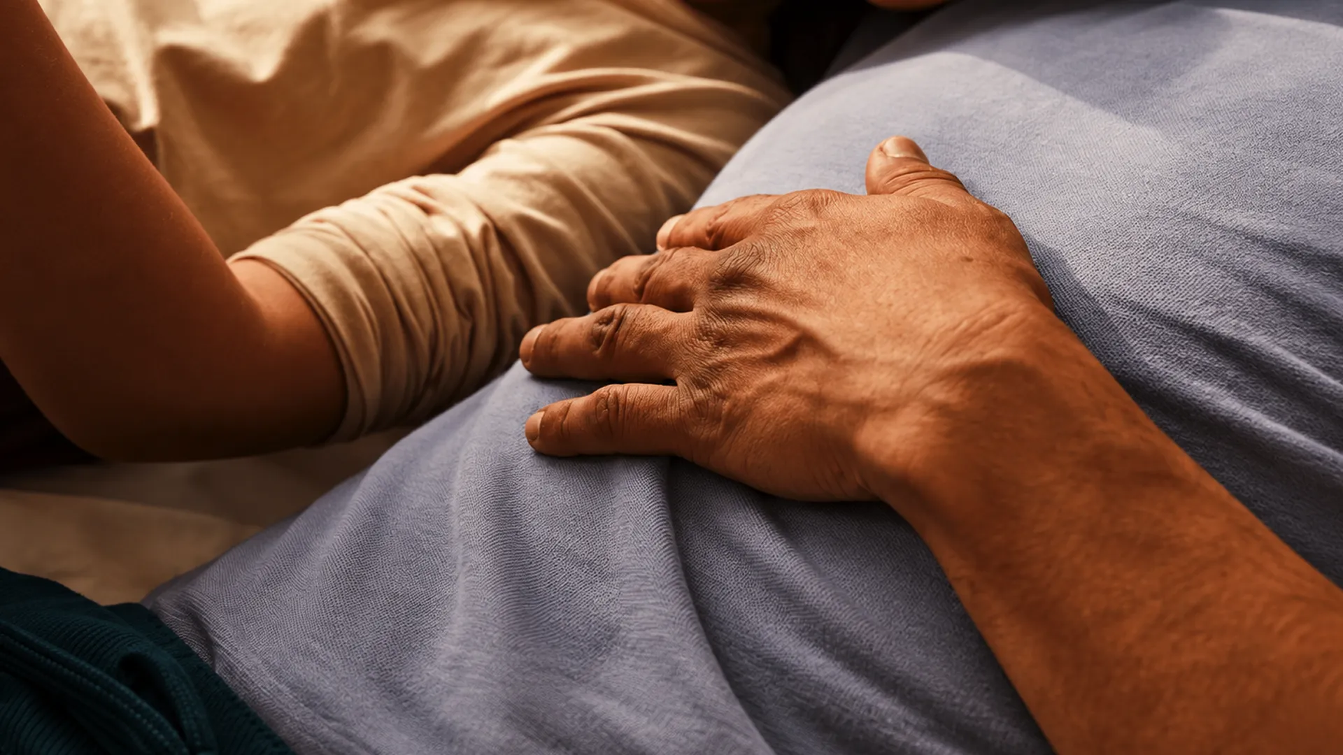 Two people lying side by side resting peacefully, representing recovery, restorative health, and the vital baseline metrics that drive longevity.