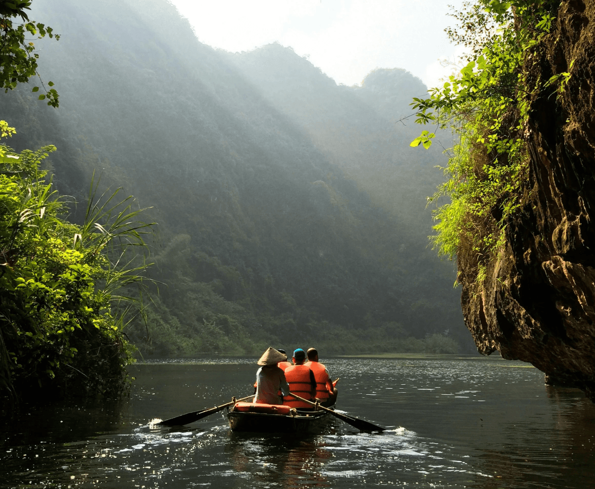 group of people on boat paddling during daytime