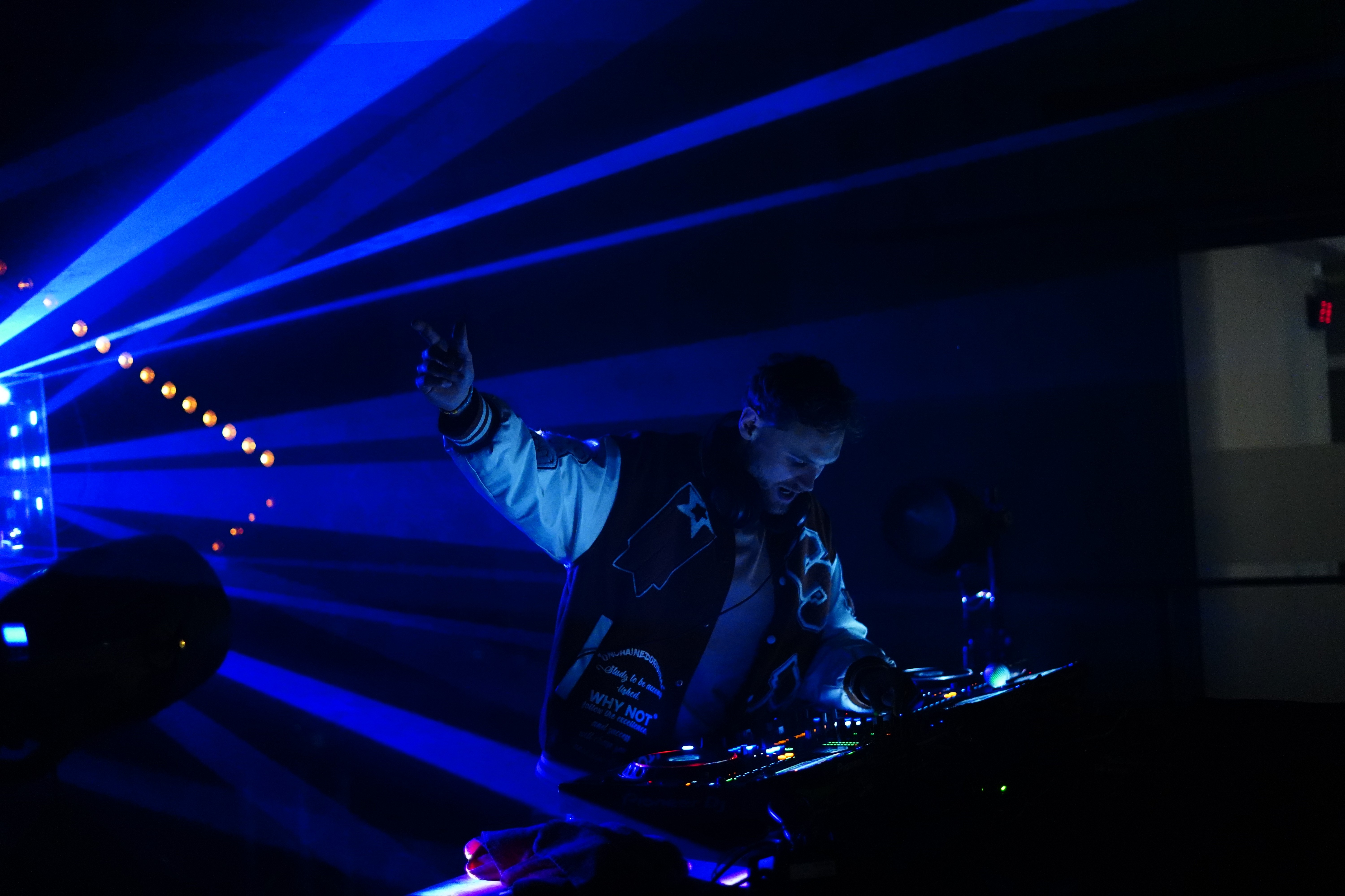 Man wearing silver headphones.