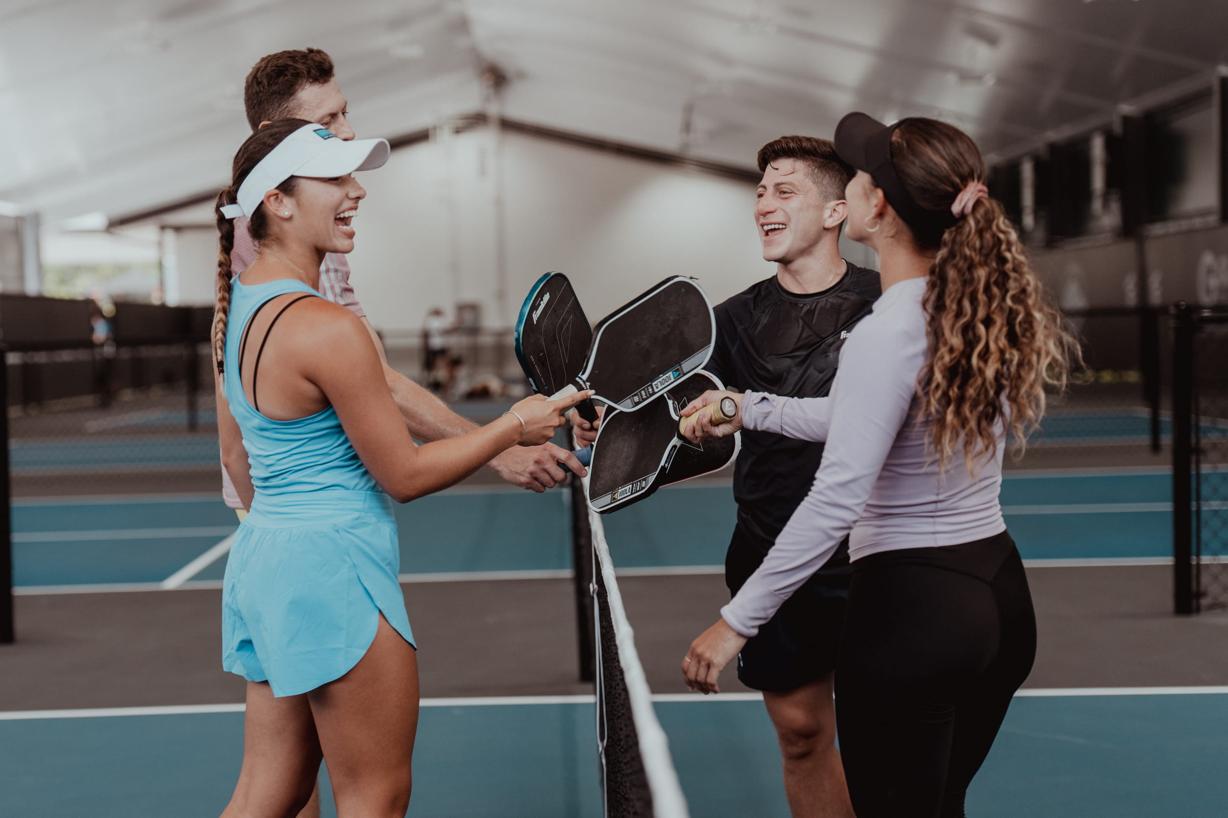people celebrating on tennis court - Why Am I So Bad at Sports